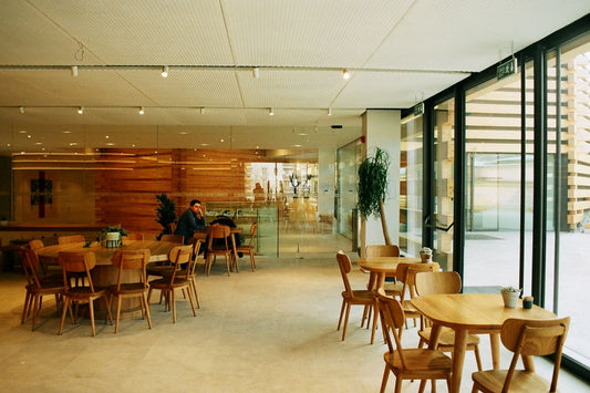 Tables and benches in a canteen dining hall