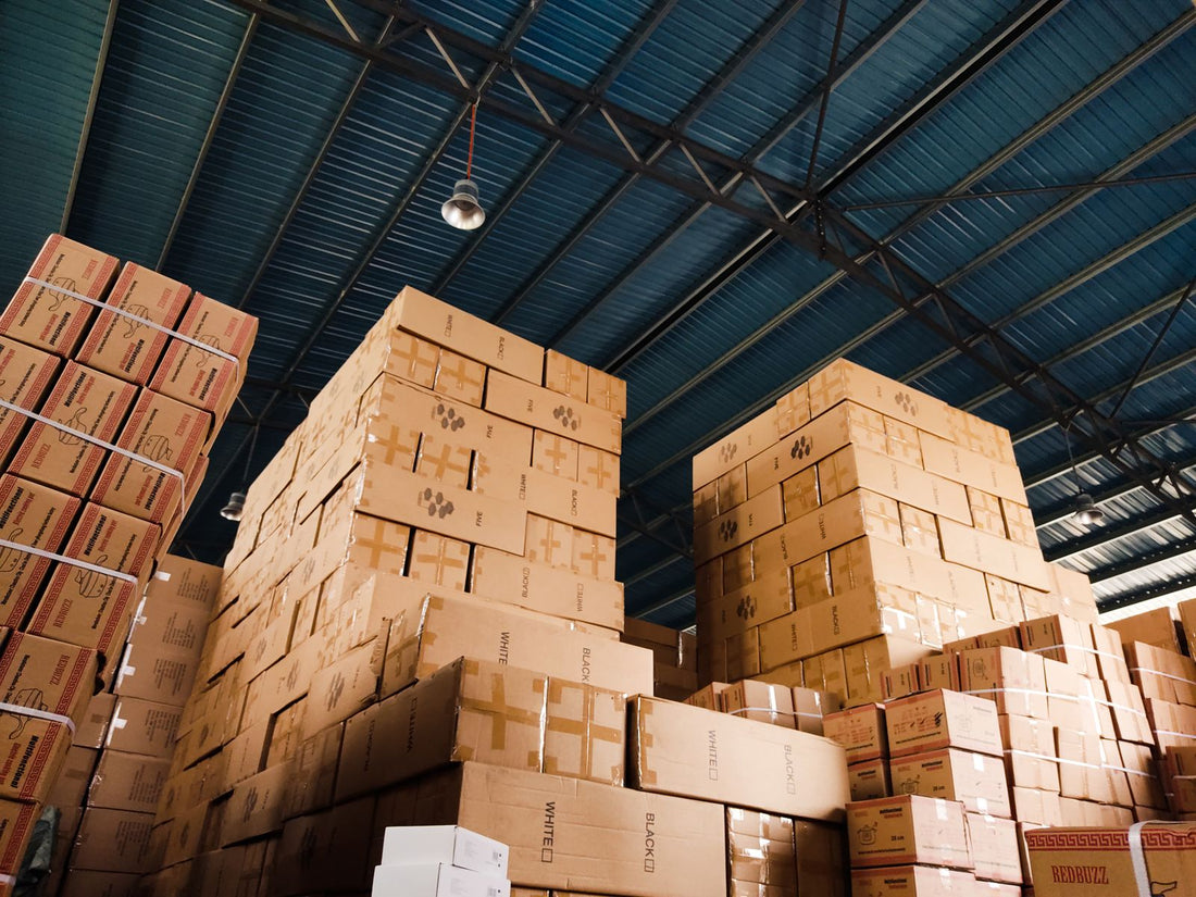Stacked boxes in a warehouse, representing different order quantities