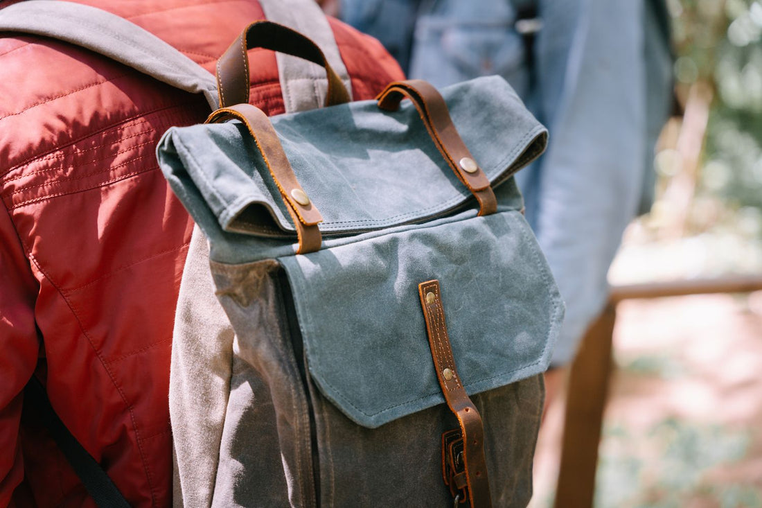 Close-up of a canvas backpack showing straps and webbing