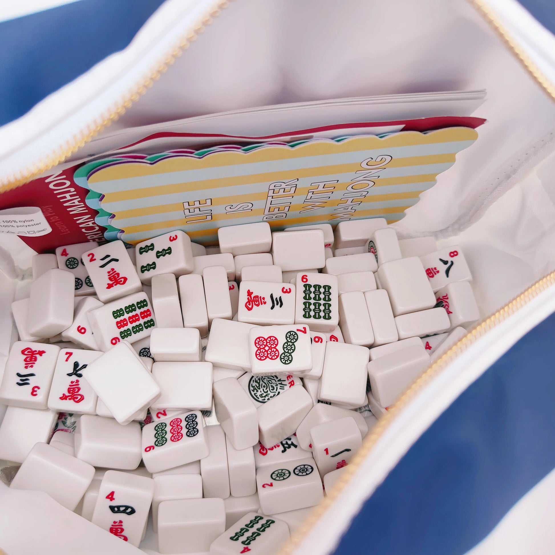 Backper Electra XL Striped Bag — holding mahjong tiles
