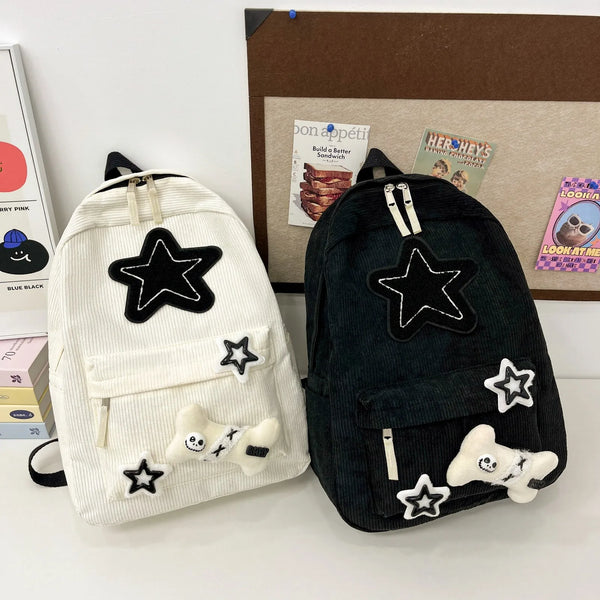 Jade corduroy star-patch student backpack in white and black