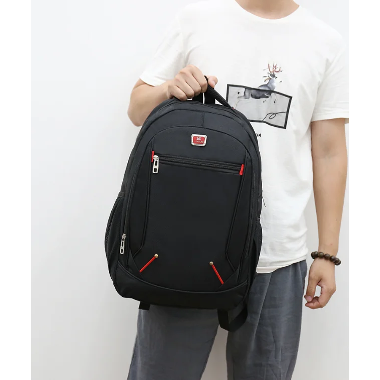 Erinome school laptop backpack in black, held by model